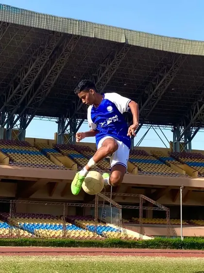 Another dynamic shot of Umesh controlling the ball mid-air. This level of skill comes from hours of dedicated and repetitive practice.