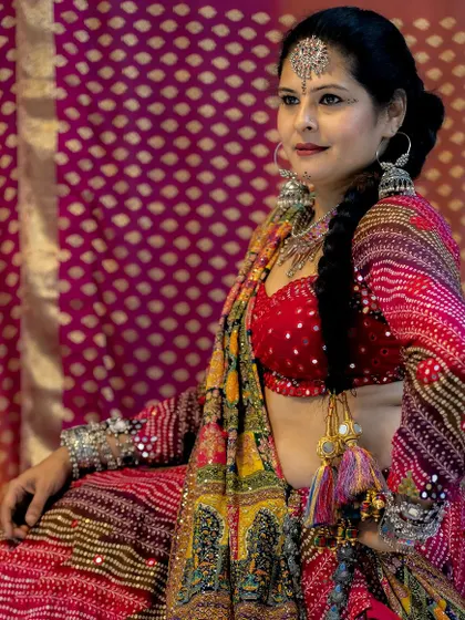 A full look at my bespoke Navratri lehenga, complete with tassels and a colorful dupatta, ready for the festivities.