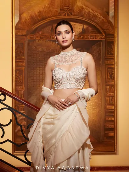 The stunning Diana Penty draped in the opulence of my Kairi Saree Set. The intricate high-neck blouse and ruffled drape tell a tale of pure, sophisticated luxury.