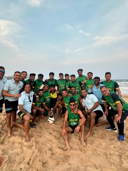 The entire Assam squad after a team bonding session at the beach. These moments are crucial for building the "namma team" feeling.