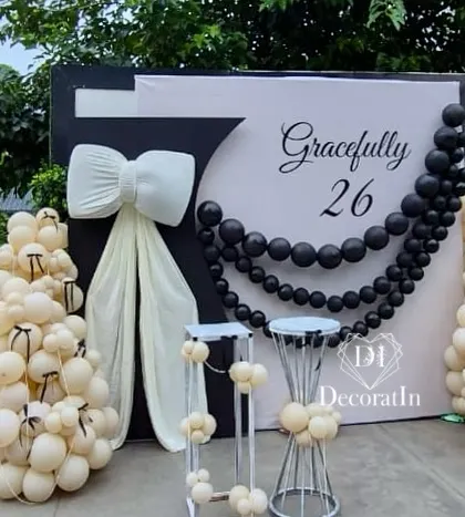 Another angle of the "Gracefully 26" backdrop, showing the full setup in its outdoor garden setting.