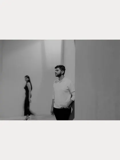 A motion-blur black and white photograph capturing a fleeting moment between the couple in Qatar. This artistic technique adds a sense of story and movement.