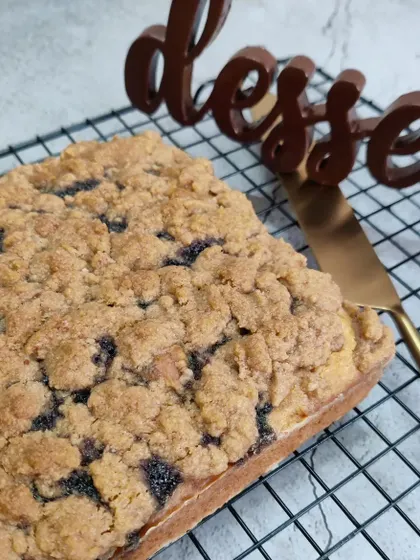 A delicious Blueberry Crumble loaf cake, with a moist cake base and a generous, crunchy crumble topping, perfect with a cup of coffee.
