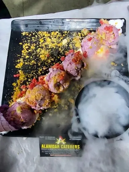 Our special deconstructed ice cream platter, served with a dramatic smoky effect for a memorable dessert experience.