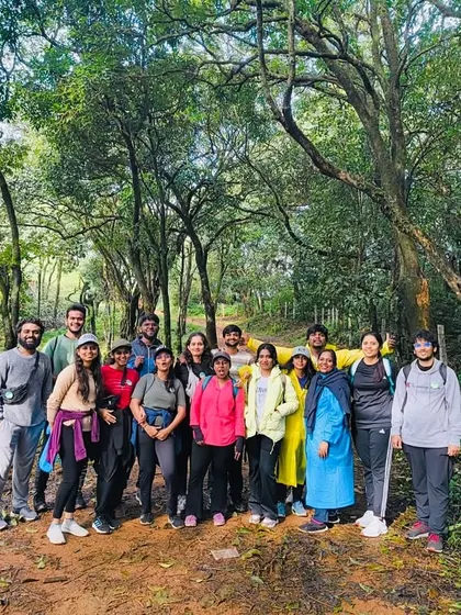 A group photo on the Kurinjal forest trail, surrounded by lush greenery.