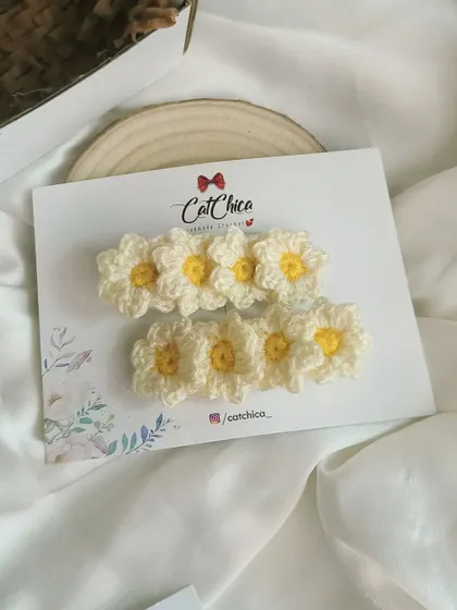 Another shot of our daisy hair clips, perfect for bringing sunny vibes to any look.
