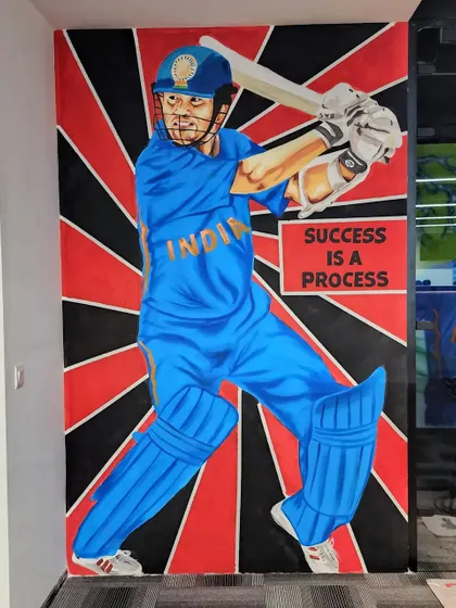 The matching mural of Sachin Tendulkar, the "Master Blaster," with the quote "Success is a process."