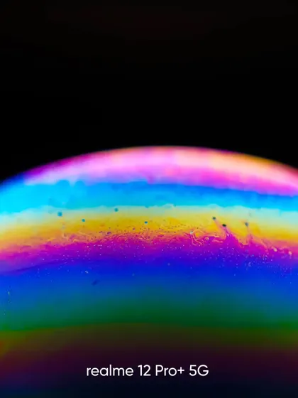 An abstract macro shot of a soap bubble, captured for a realme photo contest. This image explores the psychedelic colors and patterns on the bubble's surface, turning something ordinary into a piece of art.
