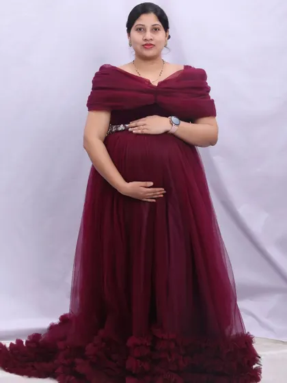 Another pose in the elegant maroon gown, this time showing an off-the-shoulder style. My convertible gowns offer multiple looks within a single photoshoot.
