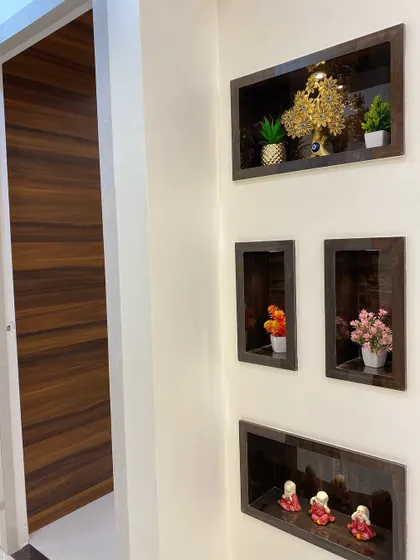 I often use wall niches as a way to add personality to a space. Here, I've created recessed wooden boxes for the client to display small plants and decorative items.