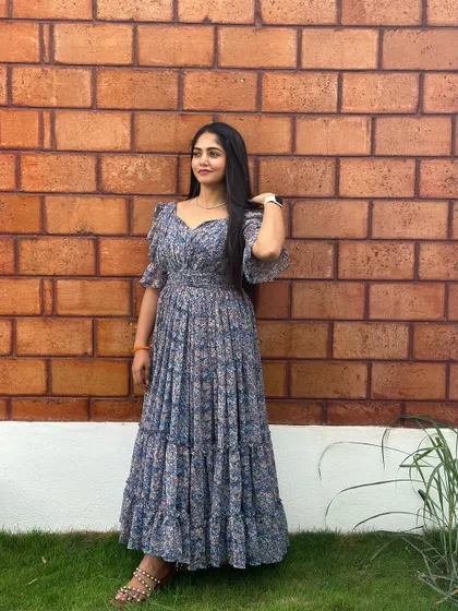 A full-length shot of the blue floral dress.