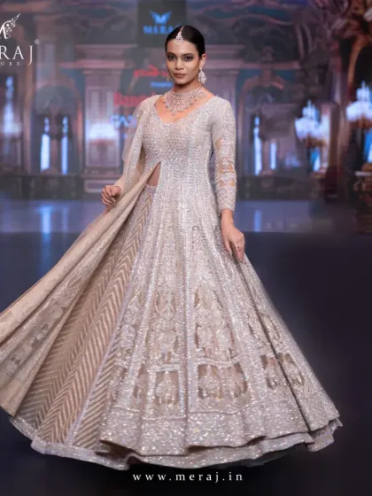 A breathtaking peach bridal Indo-Western, adorned with dazzling aari embellishment and shimmering sequins, designed to make your wedding unforgettable.