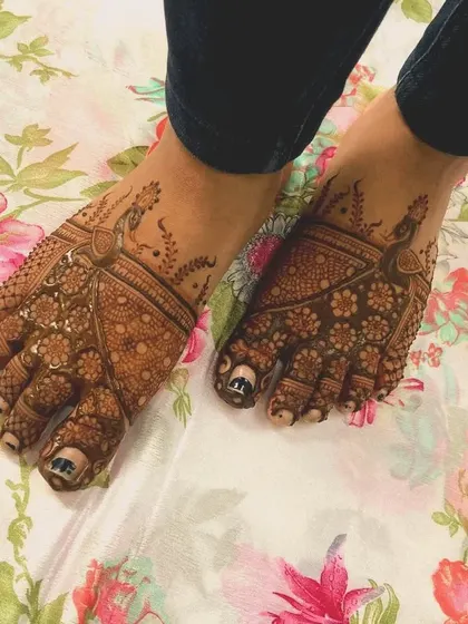 A rich, dark stain on the feet. This design features peacock and floral motifs, and the deep color is a testament to the quality of my natural henna.