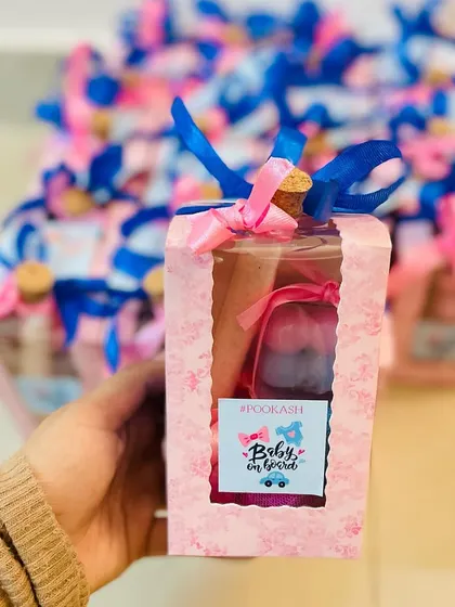 A different take on the baby shower favor, this one includes a small bottle of treats and a custom tag.