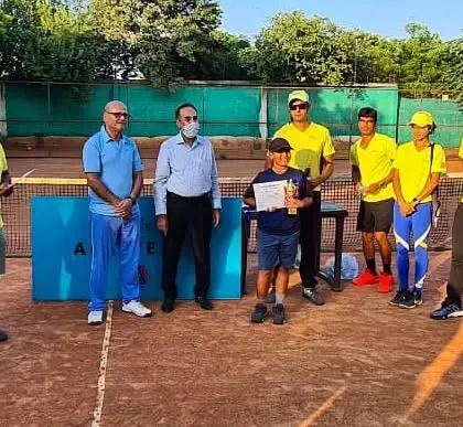 Geetansh Saini, the runner-up in our Under-8 aptitude test, receiving his trophy. We believe in celebrating effort and progress at every age.