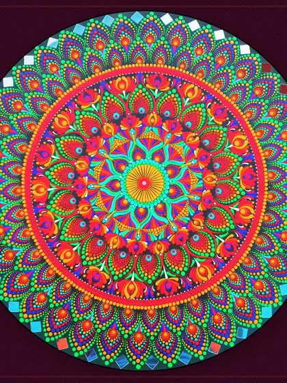 A vibrant, multi-colored dot mandala, showcasing a different technique for creating these intricate circular designs.