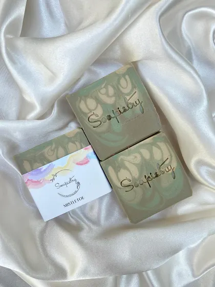 The Mistletoe soap, with its gentle green swirls, captures the feeling of a winter forest.