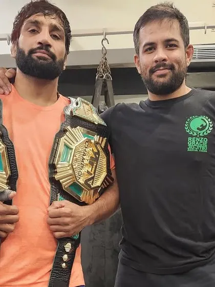 Our champion Sanjeet Budhwar with his coach after successfully defending his title. This picture represents the strong bond between our coaches and athletes.