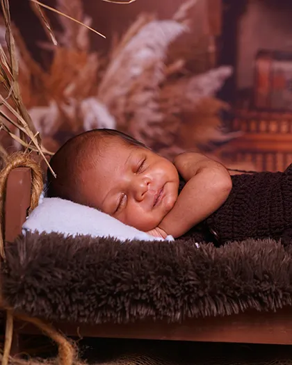 A hint of a smile from this sleeping baby. These are the magical, fleeting moments I love to capture.