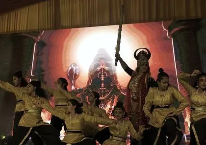 A powerful moment from our grand dance drama production of the 'Ramayan'. This image captures the scale and theatricality of our productions, where we bring epic stories to life with elaborate costumes, dramatic choreography, and a large cast of talented artists.