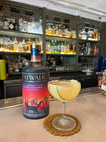 The Light Foot, another of my popular zero-proof creations. It's a refreshing, citrus-forward drink garnished with a cucumber ribbon and a dehydrated lime wheel.