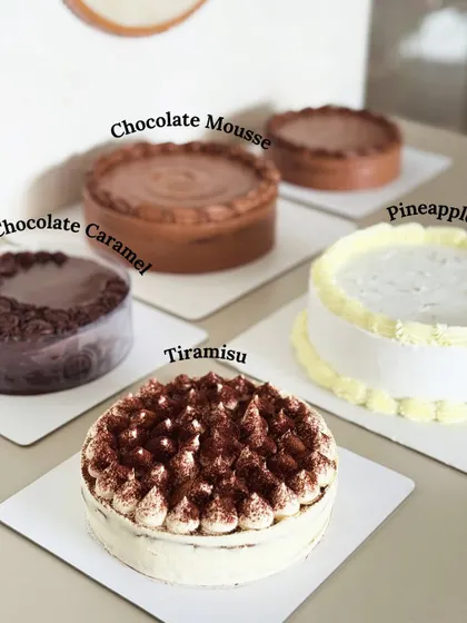 A look at some of this month's flavor highlights. We have our classic Tiramisu, a fresh Pineapple cake, and two decadent chocolate options: Chocolate Mousse and Chocolate Caramel.