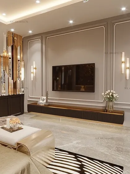 A view of the TV wall in the black and gold bedroom. The design uses a combination of grey wall paneling and a striking gold-and-black mirrored partition to separate the spaces while maintaining a sense of openness.