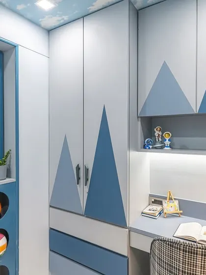 This angle captures the entire functional wall, from the creative sports ball storage on the left to the wardrobe and study nook. Every element is designed to be playful yet practical for a growing child.