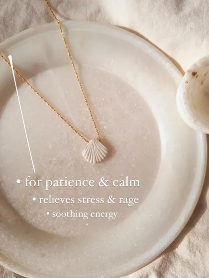 A detailed look at the 'saṅkha' Howlite Shell Pendant, showing the delicate carving. This piece is all about bringing soothing energy, patience, and calm.