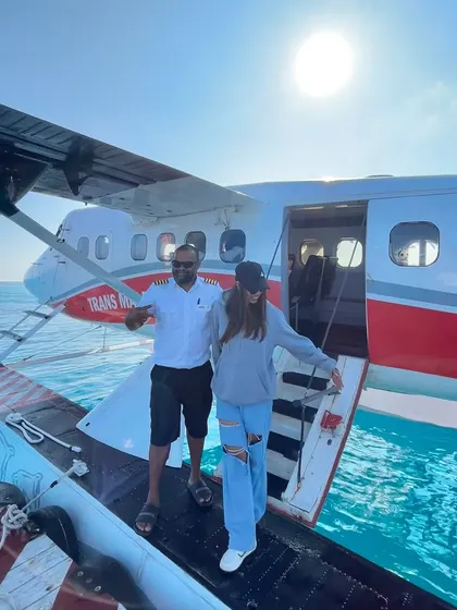 Stepping off the seaplane with the pilot, ready to bring my music to paradise.