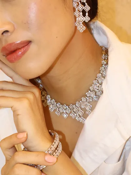 A different view of this iced out diamond set, showing the beautiful craftsmanship and how the pieces catch the light from every angle.