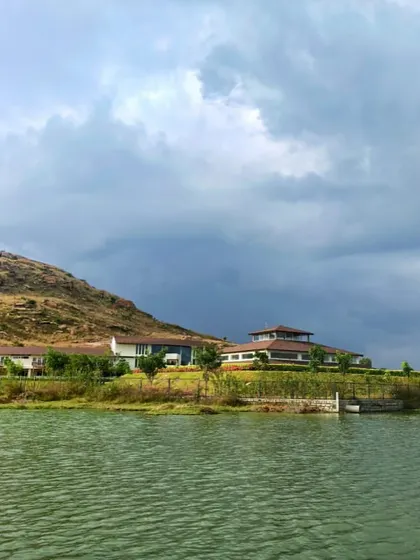 The view across the lake shows the harmonious relationship between our buildings and the natural environment. The water provides a sense of calm, while the hills offer a feeling of protective seclusion.