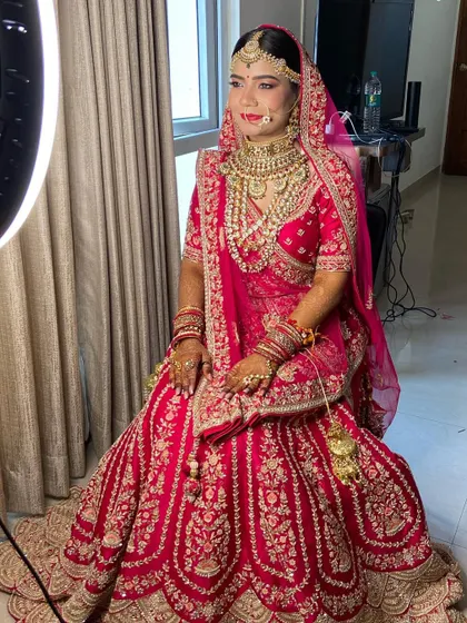 Final checks for my Marwadi bride. The full look, with the ring light illuminating her features, shows the flawless finish.