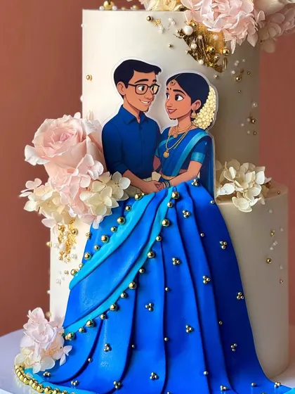 A close-up of the hand-painted couple and the intricate details of the bride's blue saree, all created with edible materials.