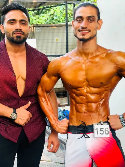 Another shot with my successful client, showing the results of our online coaching program.