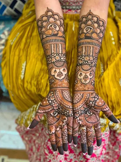 Symmetrical peacock designs on both arms create a stunning, balanced look. This is a classic choice for brides who love traditional Rajasthani art.