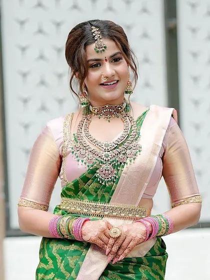 Here is Namratha in a different outfit, but the same beautiful mehendi. This shows how versatile a well-done henna design can be, complementing various traditional looks.