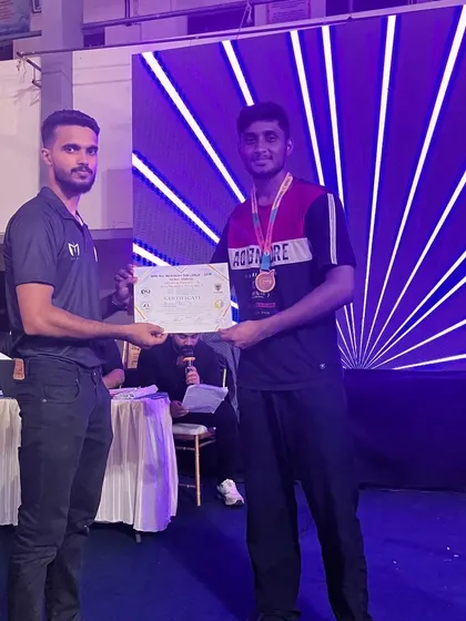 Our fighter receiving his certificate for winning gold in the -72kg weight category at the WMC All India Muay Thai League in Kerala.