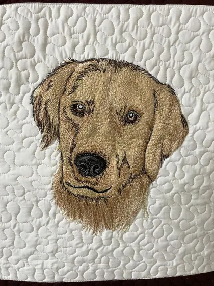 The Golden Retriever portrait from the same art quilt, capturing the dog's gentle expression.