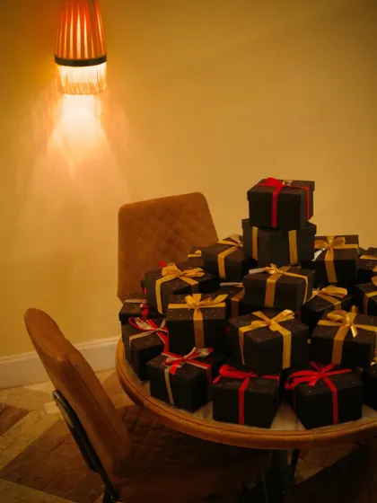 A pile of beautifully wrapped Christmas gifts, part of our festive decor and a symbol of the season of giving.