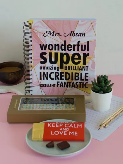 This thoughtful and personalized gift set is perfect for Valentine's Day or any occasion, combining a custom journal with sweet treats.