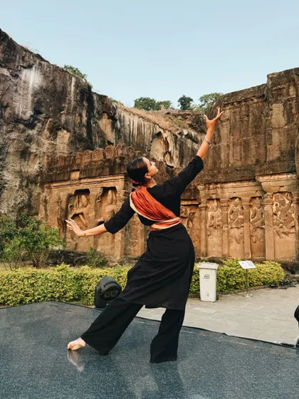 A dance pose in front of the Ellora Caves. I often use my travels to create beautiful dance photography, merging the art form with stunning architectural and natural backdrops.