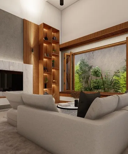 A full view of a contemporary living room, showcasing the L-shaped sofa, the textured accent wall behind the TV, and the large window that offers a view of the garden.