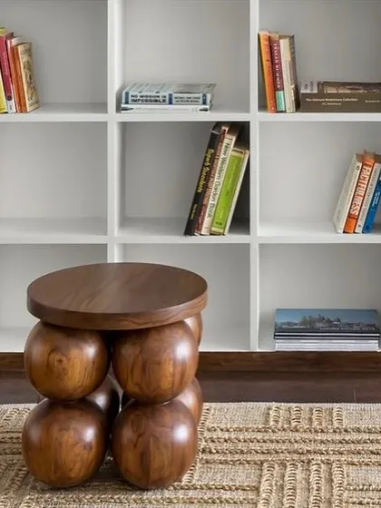 A detail of the custom-made wooden stool in the West Coast Residence, showcasing its playful, sculptural form.