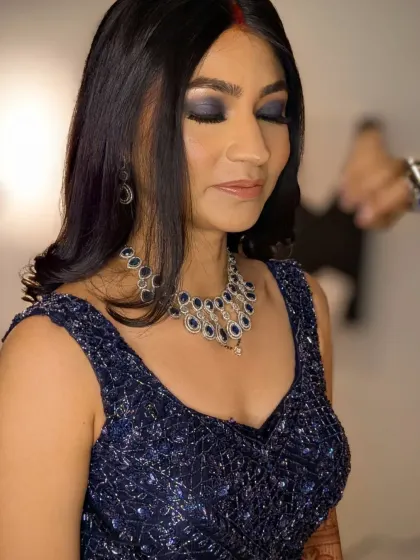 Eyes that talk. For Rashi's reception, we went with bold blue smokey eyes, balanced with fresh dewy skin and nude lips to match her navy gown.