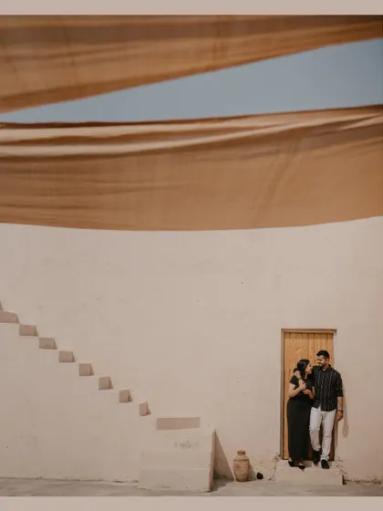 A minimalist and architectural shot from a destination pre-wedding shoot in Dubai, using the clean lines and shadows of the building.