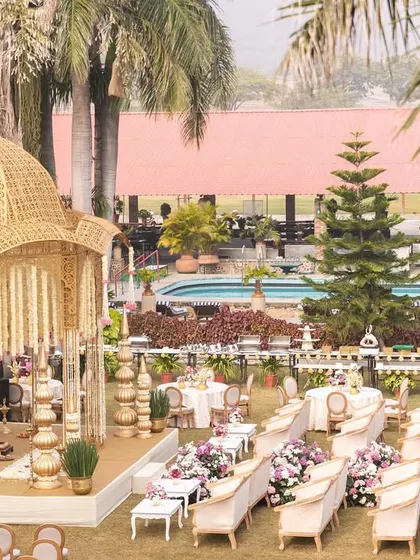 A closer look at the intricately designed golden mandap, showcasing its structure and the surrounding seating arrangement for an intimate yet grand ceremony.