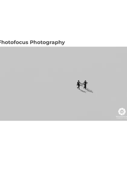 This award-winning photograph showcases our fine-art approach. The minimalist composition and dramatic shadows create a powerful, artistic statement about two people walking their path together.