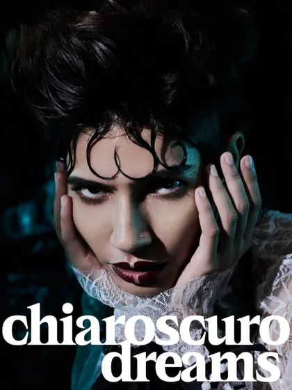 A tight, intense close-up from the "Chiaroscuro Dreams" editorial.