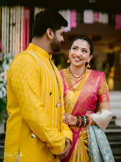A sweet glance shared between Maithili and Dhruv during their engagement in Satara.